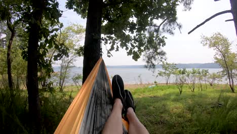 view of lake from hammock swinging in the breeze