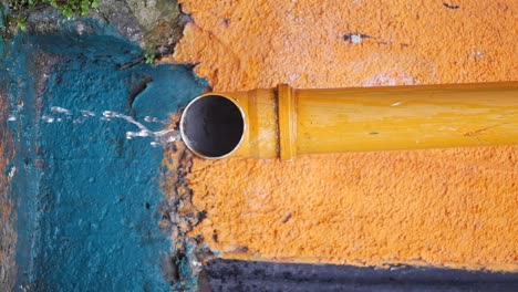 water draining from a gutter