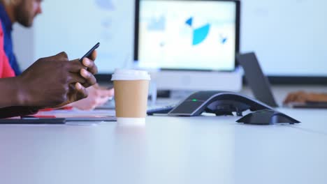 mid section of male executive using mobile phone in modern office 4k
