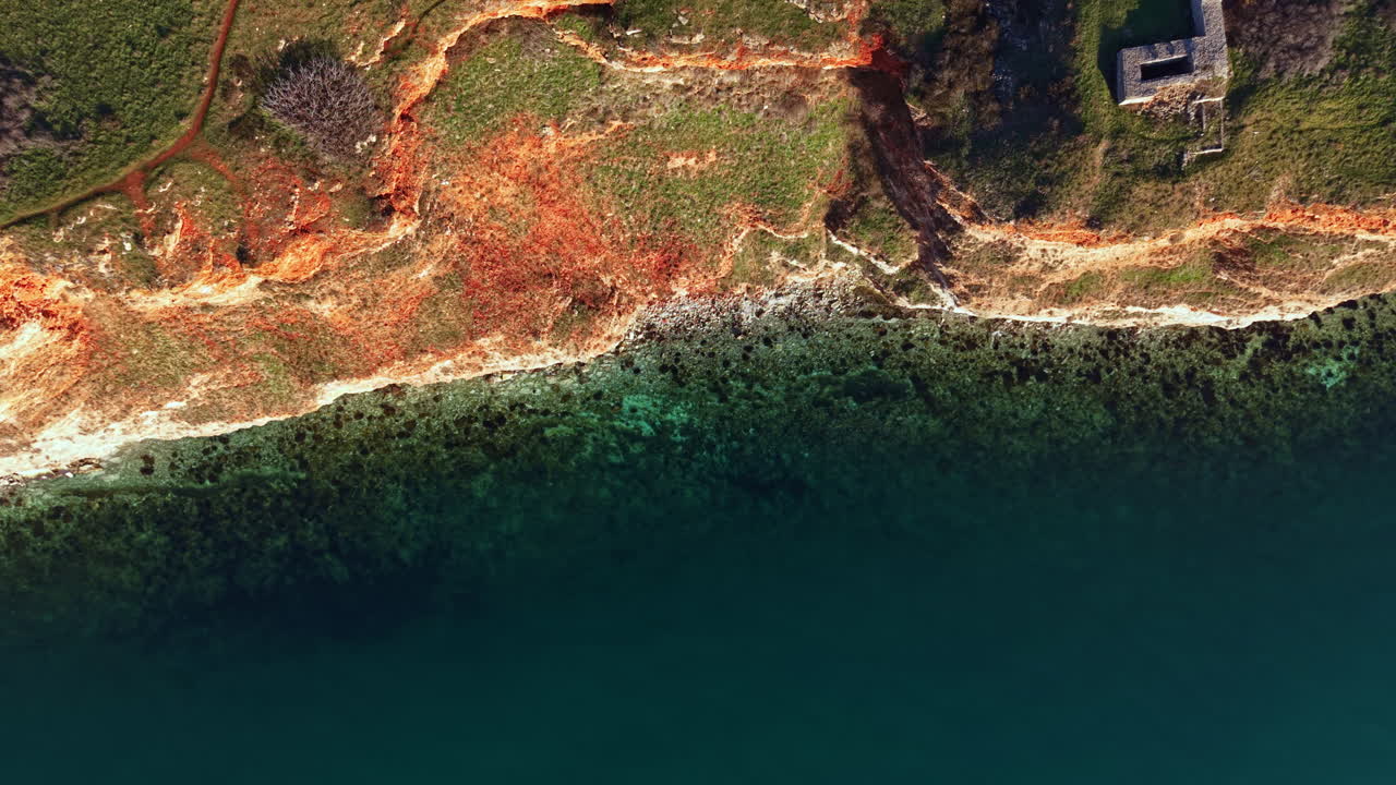 Scenic view of coastal landscape with water and land features observed from above during daytime hours