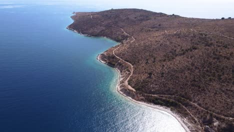 AERIAL-Side-Panning-Shot-of-a-Mediterranean-Peninsula-in-Albanian-Riviera