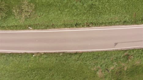 top shot of a car driving on a street