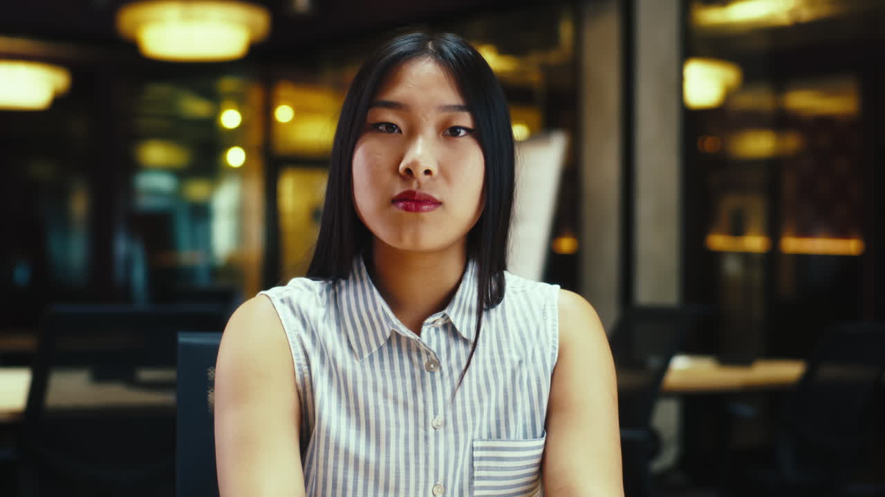 Asian woman in striped shirt portrait