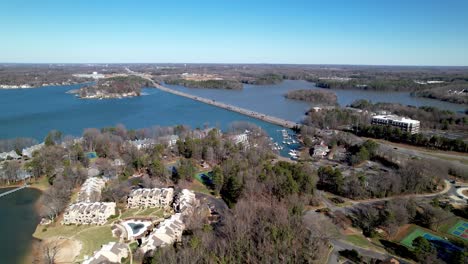 aerial-push-in-to-causeway-at-lake-norman-nc,-near-davidson-nc-and-cornelius-nc