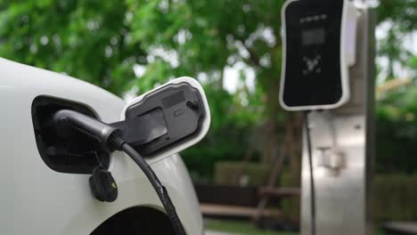 Progressive-concept-of-electric-car-parking-and-recharging-at-charging-station.