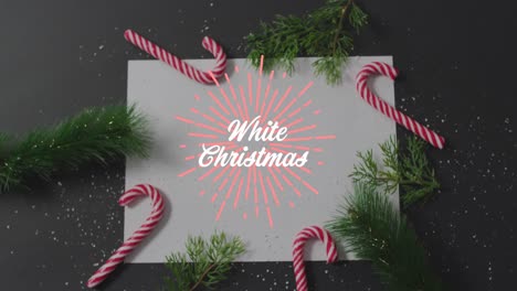 animation of white christmas text over decorations