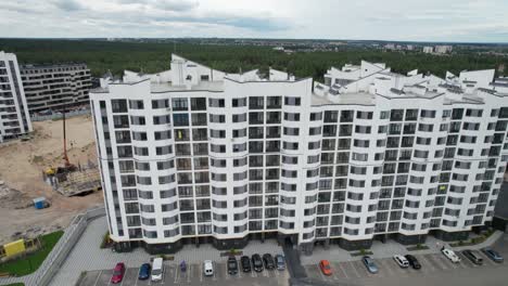 aerial view of a newly modern multi-storey building in a forest area