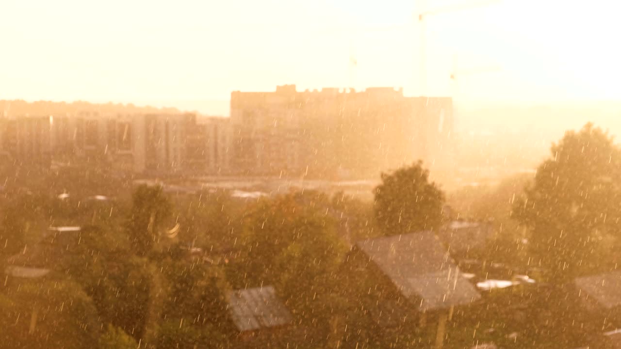Heavy rain with sun. Beautiful view of the city.
