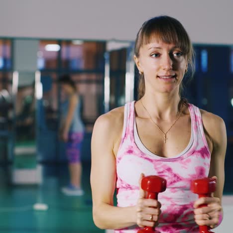 Woman-does-an-exercise-with-dumbbells