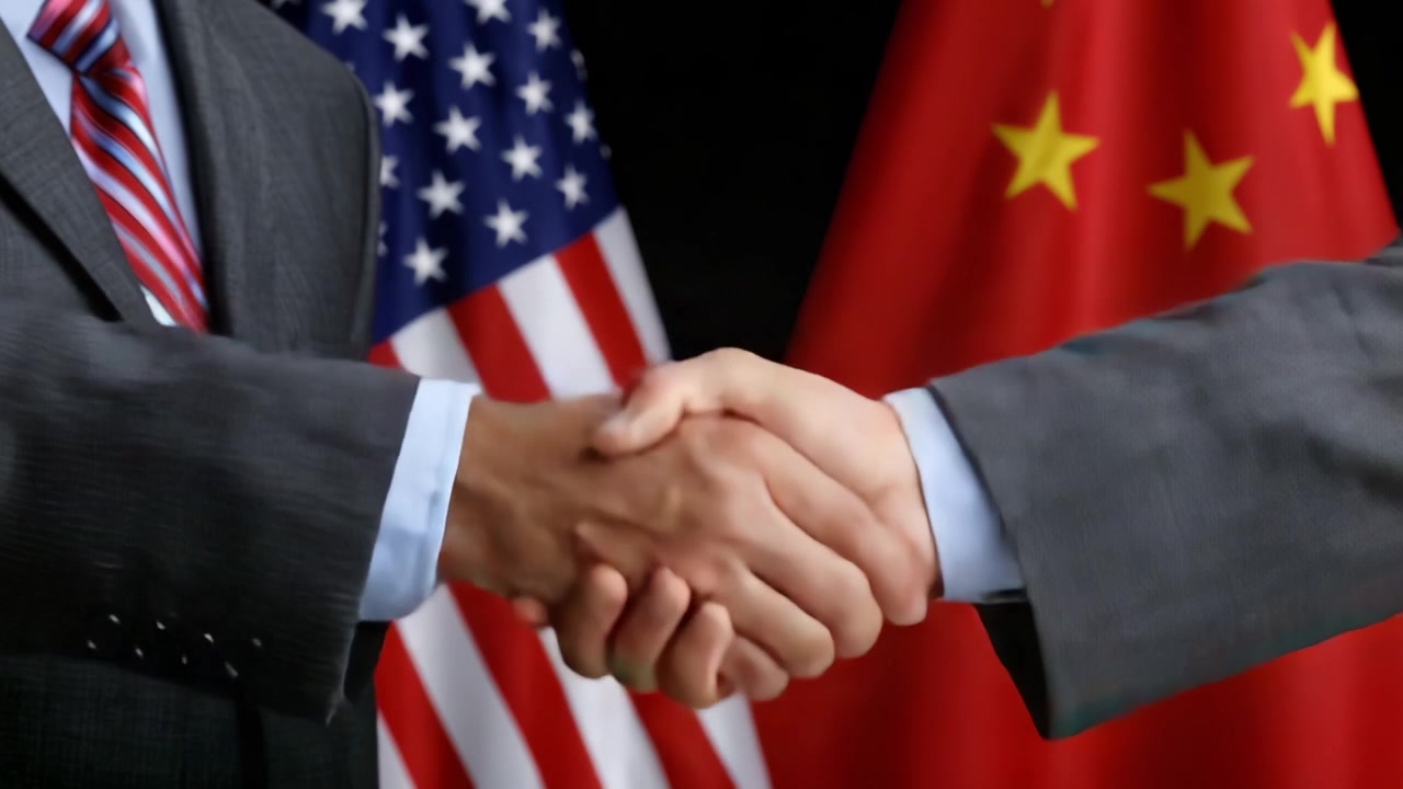 Diplomatic Gesture: A Symbolic Handshake Between Representatives from Different Nations Amidst Their Flags, Signifying Cooperation and Future Relations.