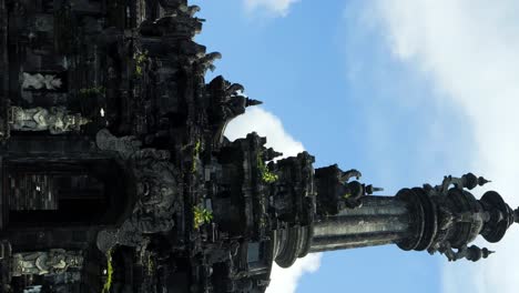 vertical slow motion shot featuring the bajra sandhi monument in bali, an embodiment of balinese architectural beauty, commemorating the historical struggle of the balinese people against dutch people