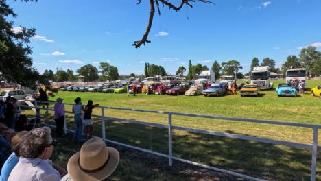 spectators enjoying vintage cars at outdoor event