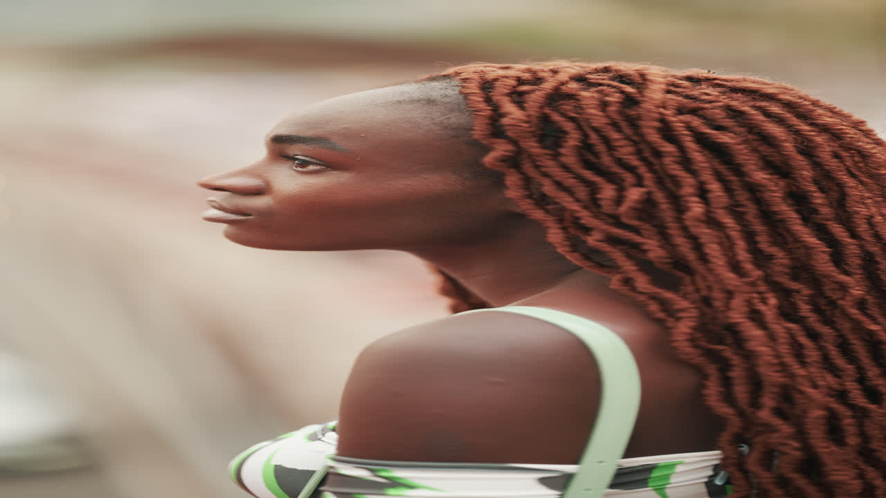 Portrait of a woman with red dreadlocks