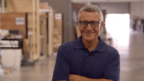 male factory worker walks towards camera in slow motion