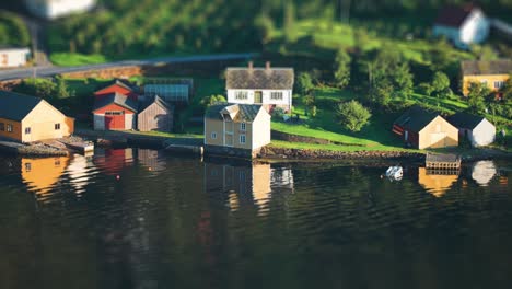 miniaturized cottages and boathouses on the shores of the hardanger fjord