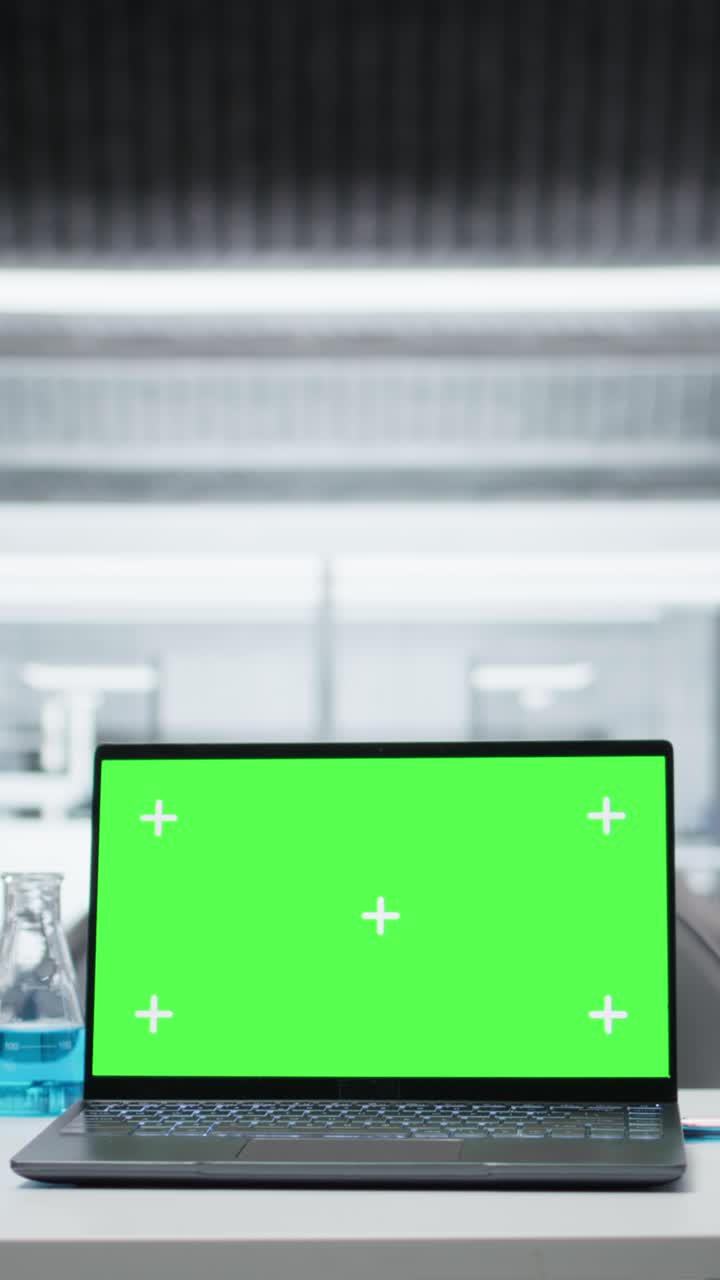 Vertical video Close up of isolated screen laptop on workbench in sterile empty laboratory