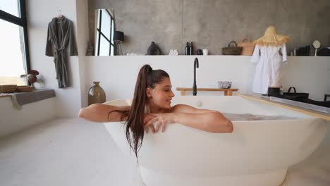 woman relaxing in modern spa bath