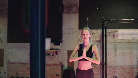 Beautiful-Young-Woman-In-Sportswear-Practicing-Yoga-At-Fitness-Studio-7