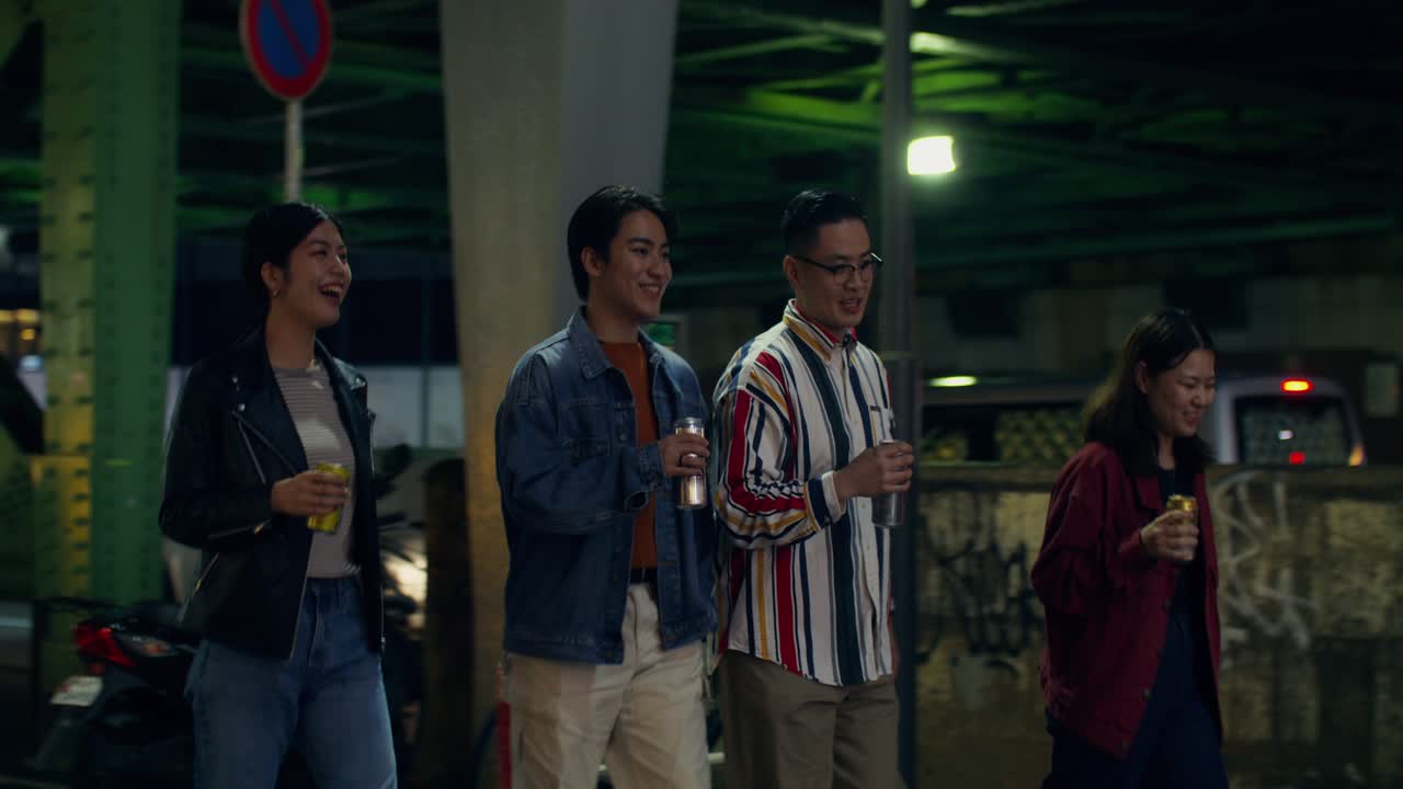 Friends Walking at Night in a City