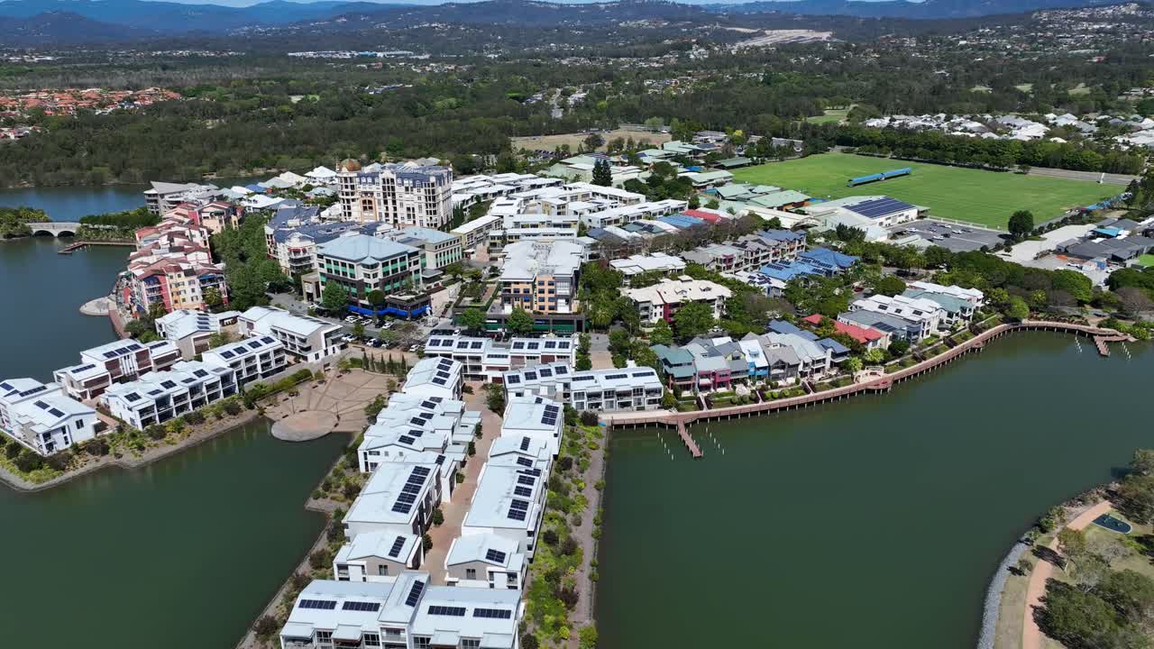 Stunning drone footage showcases Emerald Lake Community Centre and apartments, highlighting the vibrant community, modern amenities, lush surroundings, and scenic views of the area.