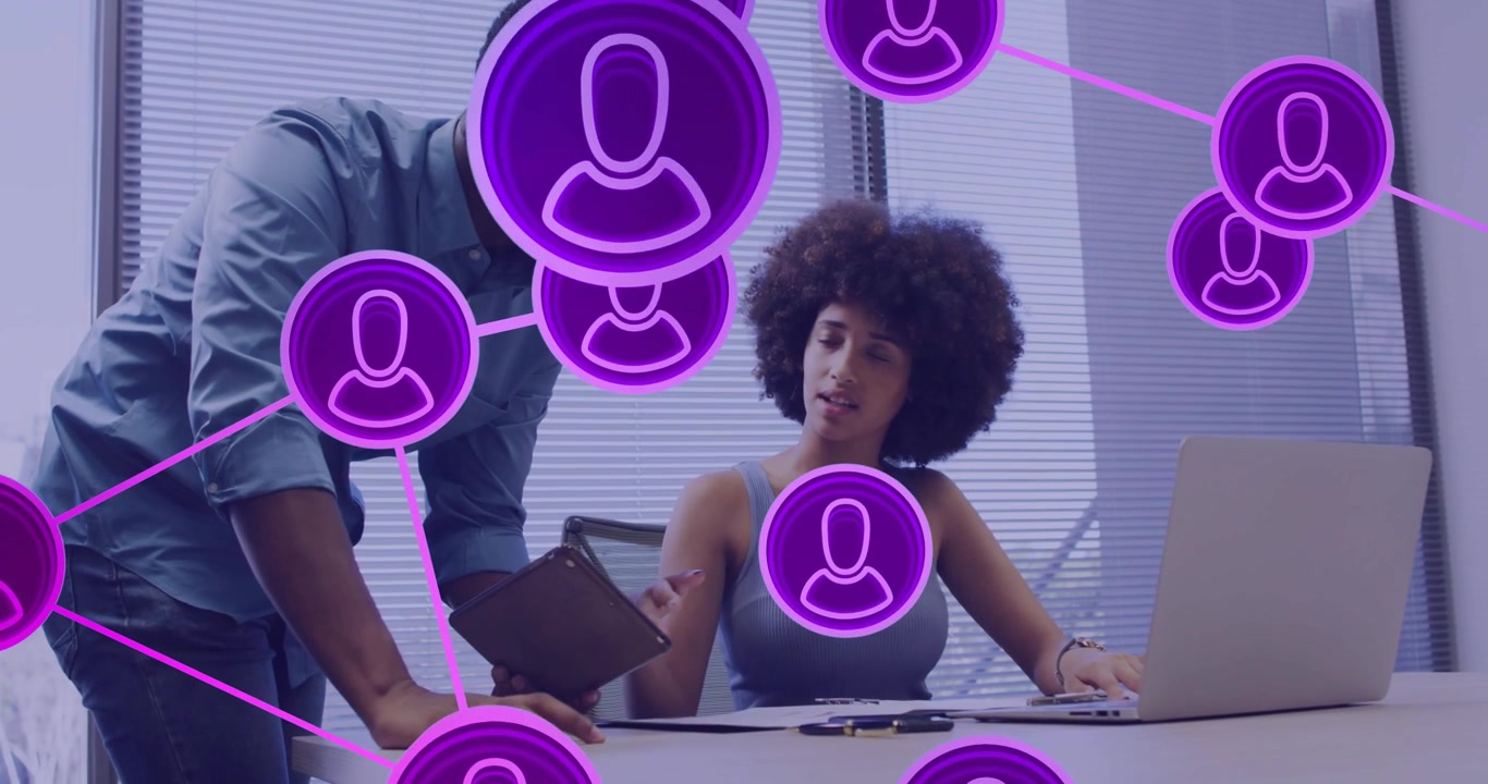 Woman tapping laptop, causing purple nodes growing while man leaning with clipboard for business
