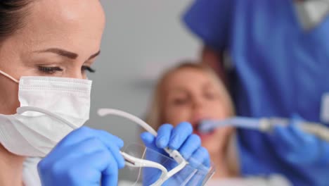 female dentist at work in dentist's office