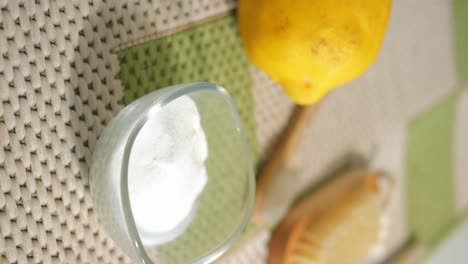 baking soda, lemon, and brush for natural cleaning