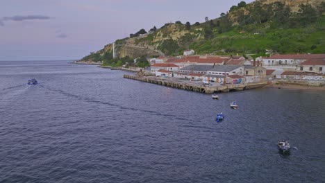 drone shot of the old warehouses by the riverside in almada