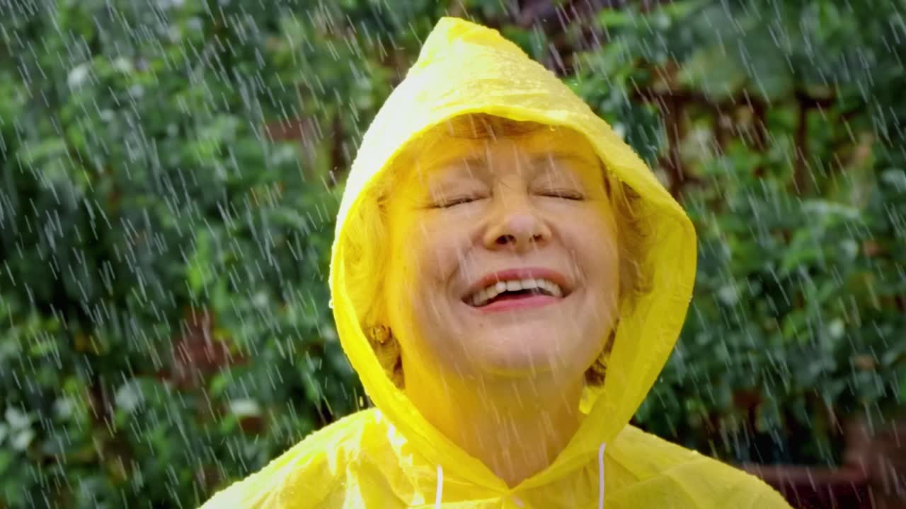 Happy Woman Enjoying a Rainy Day