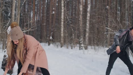 young couple playing outdoors. winter season.