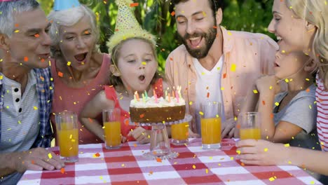 Animation-of-confetti-falling-over-family-having-fun-at-birthday-party