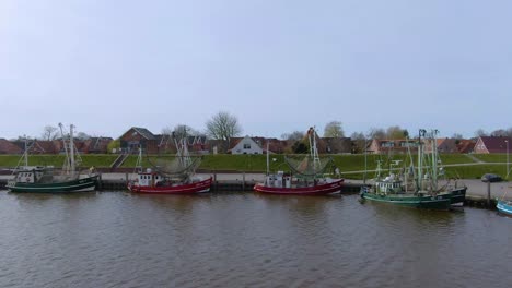 Drone-flight-over-a-tranquil-and-idyllic-fishing-port-in-germany