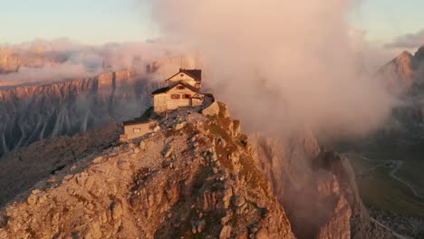 rifugio nuvolau basking in glow of sunset and some low clouds