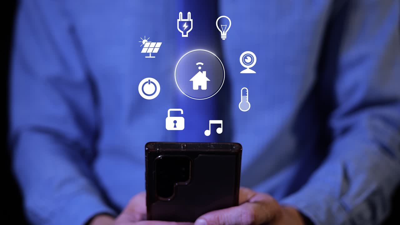 Hands Using Smartphone Displaying Smart Home Control Interface With Various Icons. Home Automation. closeup shot