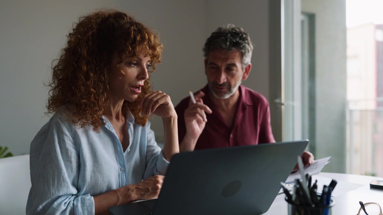 Professional Colleagues Collaborating on a Project in a Modern Office