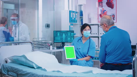 presenting green screen tablet to patient