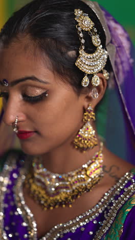 vertical video close up on jewellery of female kathak dancer performing dance wearing traditional indian dress 1