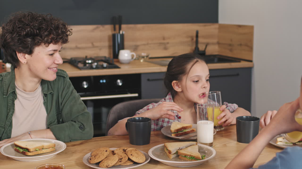 Happy Family Eating Sandwiches For Breakfast