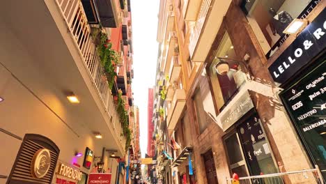 busy street with shops and pedestrians