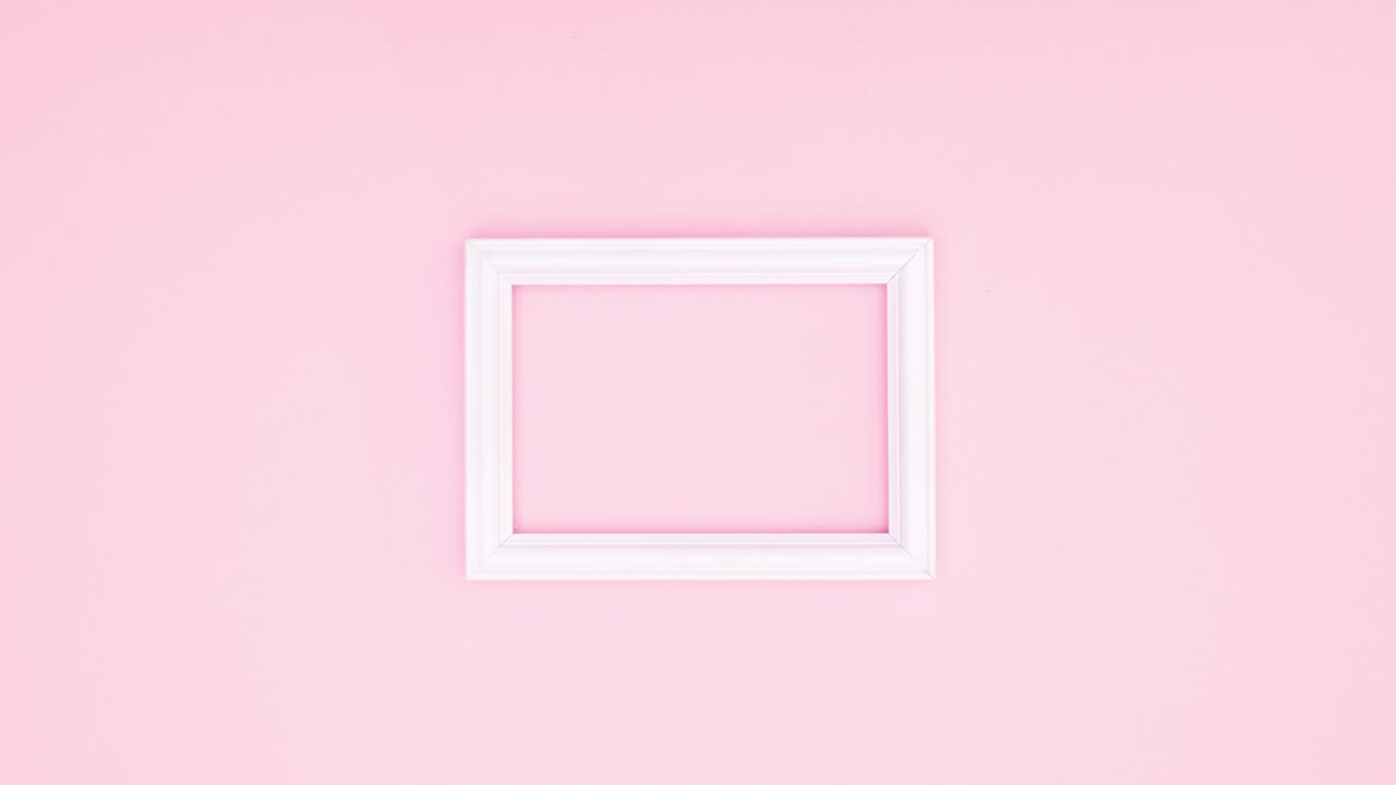 Romantic roses surround white frame for text on pink theme. Stop motion