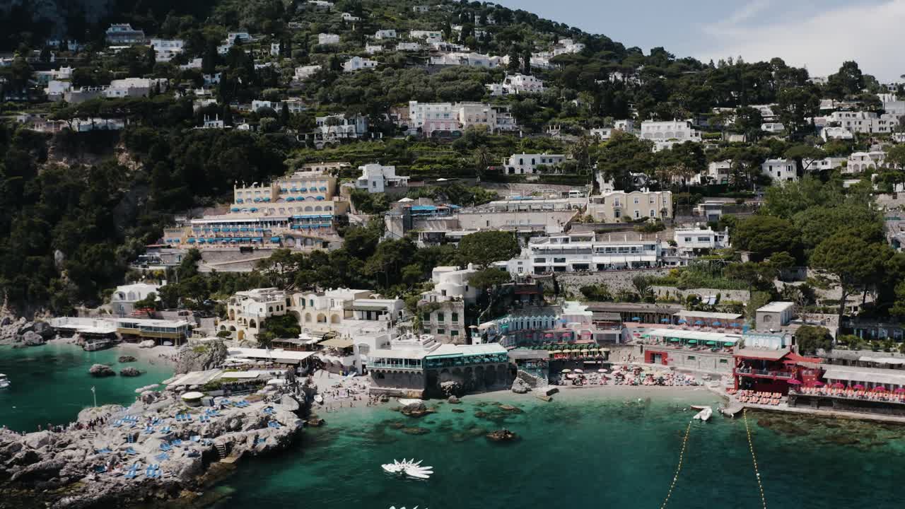 Wide aerial view of Capri, Italy's tourist-centric shoreline