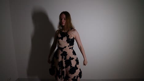 young woman dancing in a dress
