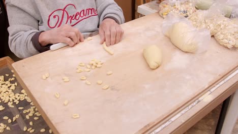 traditional preparation of handmade orecchiette pasta in bari italy