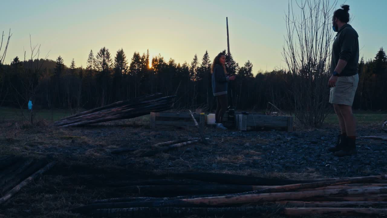 Charring Wooden Logs at Sunset to Preserve Them Using a Traditional Method - Timelapse