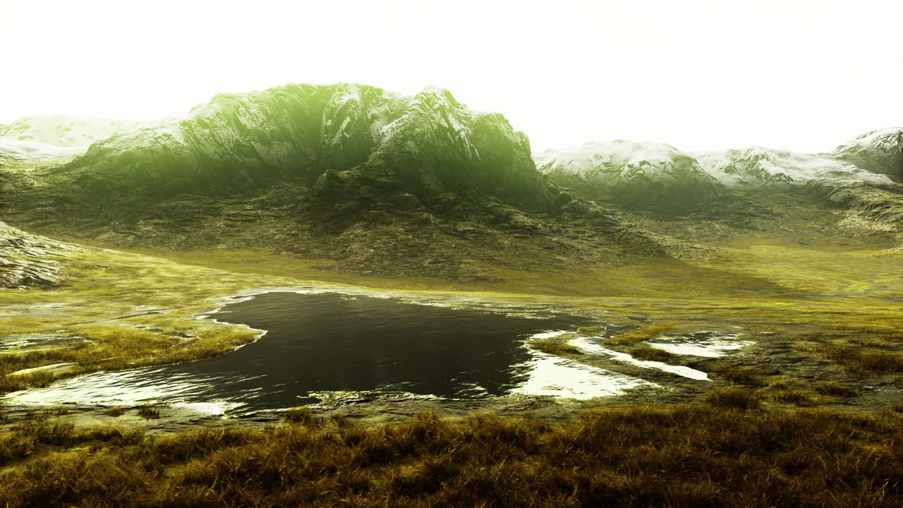 Mountain landscape with a serene lake reflecting sunlight in the afternoon