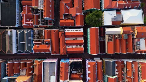 Drone-top-down-overview-above-bright-orange-colorful-vibrant-roof-of-Willemstad-Curacao