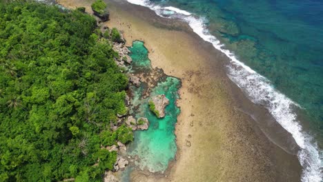 4k drone video over the magpupungko rock pools on siargao island in the philippines