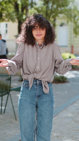 young woman in casual attire smiling at the camera