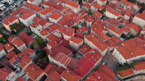 Aerial-Topdown-Of-Red-Roofscape-Of-The-Coastal-Old-Town-In-Budva,-Montenegro