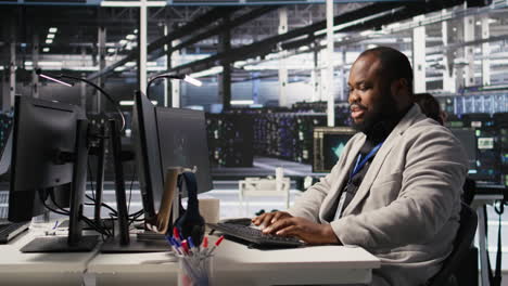 vertical video data center system administrator monitoring servers gear performing ai training